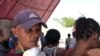 This man in Port-au-Prince, Haiti, came with his own mask on April 1, 2020, but said he still may go home infected with coronavirus.