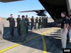 Members from Defense POW/MIA Accounting Agency (DPAA), conduct a dignified transfer ceremony for possible human remains during a DPAA investigation mission at the Diburgarh Airport, Arunachal Pradesh, India, Dec. 13, 2016.