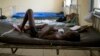 A child suffering from the Ebola virus receives treatment at Makeni Arab Holding Centre in Makeni, Sierra Leone, Saturday, Oct. 4, 2014. Makeni is one of three districts recently quarantined by the government. (AP Photo/Tanya Bindra)