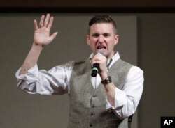 FILE - Richard Spencer, who leads a movement that mixes racism, white nationalism and populism, speaks at Texas A&M University in College Station, Texas, Dec. 6, 2016.