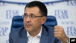 Valery Seleznev, a Russian lawmaker and father of now-convicted hacker Roman Seleznev, speaks to reporters in Moscow, July 11, 2014. Roman Seleznev's family had insisted he was not guilty and feared incarceration would kill him.