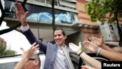 Venezuelan opposition leader Juan Guaido, whom many nations have recognized as the country's rightful interim ruler, leaves after a rally in support of the Venezuelan National Assembly and against the government of Venezuela's President Nicolas Maduro in Caracas, May 11, 2019.