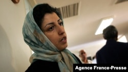 FILE - Iranian opposition rights activist Narges Mohammadi is seen at the Defenders of Human Rights Center in Tehran, June 25, 2007. The Nobel Peace laureate has been temporarily released from prison on medical grounds, her lawyer said on Dec. 4, 2024.