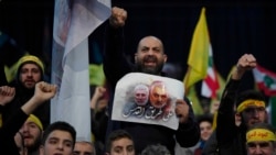 Supporters of Hezbollah leader Sayyed Hassan Nasrallah chant slogans ahead of the leader's televised speech in a southern suburb of Beirut, Lebanon, Sunday, Jan. 5