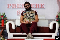 FILE - An Indian spiritual guru, who calls himself Saint Dr. Gurmeet Ram Rahim Singh Ji Insan, attends the premiere of the movie 'Jattu Engineer' in New Delhi, India, May 17, 2017.