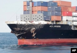 In this photo released by Japan's 3rd Regional Coast Guard Headquarters, the damage of Philippine-registered container ship ACX Crystal is seen in the waters off Izu Peninsula, southwest of Tokyo, after it had collided with the USS Fitzgerald, June 17, 2017.