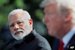 FILE - Indian Prime Minister Narendra Modi looks toward President Donald Trump as he speaks in the Rose Garden at the White House, June 26, 2017, in Washington.