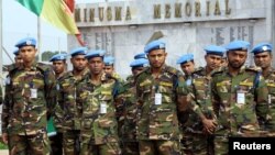 FILE - U.N. peacekeepers attend a memorial ceremony for their comrades at the MINUSMA base in Bamako, Mali, Sept. 27, 2017. 