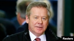 FILE - Russia's Deputy Foreign Minister Gennady Gatilov arrives for a meeting on Syria at the United Nations European headquarters in Geneva, Dec. 20, 2013.