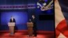 Republican presidential nominee Mitt Romney (l) debates President Barack Obama at the University of Denver, Oct. 3, 2012, in Denver