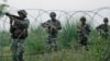FILE - Indian army soldiers patrol near the highly militarized Line of Control dividing Kashmir between India and Pakistan, in Pallanwal sector, about 75 kilometers from Jammu, India, Oct. 4, 2016. 