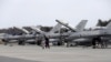 FILE - U.S. Air Force 510th Fighter Squadron F-16 fighters are seen parked on tarmac in Amari air base, in Estonia. Lockheed Martin says talks are being held between the American and Indian governments on its proposal to manufacture F-16 fighter jets in India.