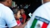 Mexican migration officials check peoples' identification cards at a checkpoint in Tapachula, Chiapas state, Mexico, June 9, 2019.