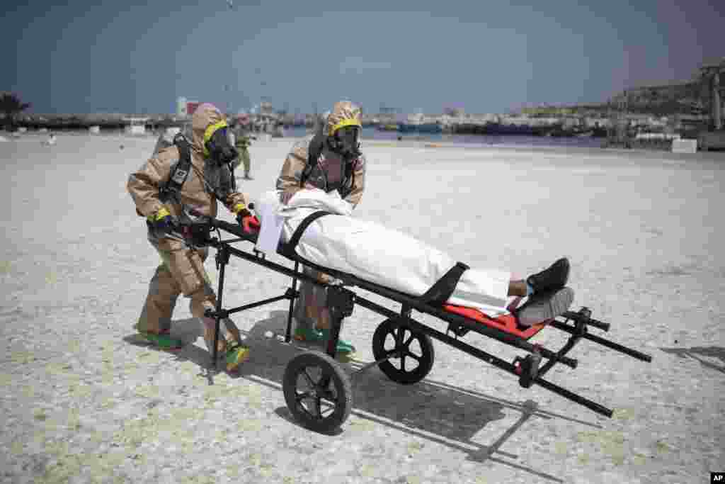 Members of the Moroccan Royal Armed Forces Rescue &amp; Relief Unit take part in a biochemical simulation organized by the U.S, Defense Threat Reduction Agency (DTRA) as part of an African Lion military exercise, in the port of Agadir, southern Morocco.