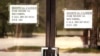 FILE - Signs are displayed at the recently closed Pickens County Medical Center in Carrollton, Ala., March 26, 2020. Many rural health care facilities have had to shut down in recent years, and hundreds of others are in jeopardy.