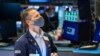 Trader Robert Charmak works on the floor on Jan. 24, 2022, in this photo provided by the New York Stock Exchange,