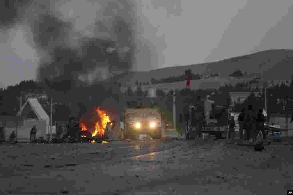Smoke rises near the U.S. consulate after an attack in Herat, Afghanistan, Sept. 13, 2013. 