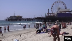 Santa Monica Pier is 25 km from downtown Los Angeles. It is a place frequented by locals and tourists alike. (E. Lee/VOA)