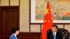 FILE - Chinese President Xi Jinping speaks with Hong Kong Chief Executive Carrie Lam, during their meeting, in Beijing, China, Dec. 16, 2019. 