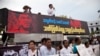 FILE - Activists hold placards during a protest against the killing of Aung Kyaw Naing, a freelance journalist, outside the city hall in Yangon, Myanmar, Oct. 26, 2014. 