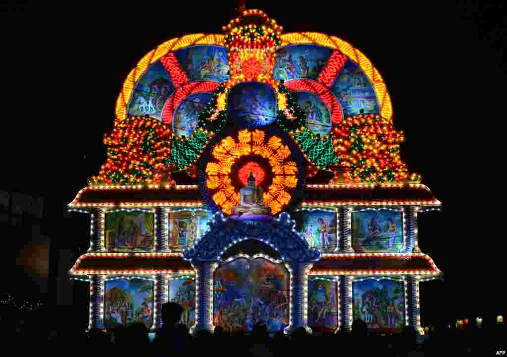 A view of a giant display featuring a seated Buddha during the annual Vesak Buddhist festival celebrations in Colombo, Sri Lanka.