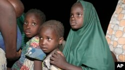 FILE - Children rescued from Boko Haram kidnappers by Nigeria soldiers in the Sambisa forest arrive at a camp in Yola, Nigeria, May 2, 2015. 