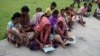A group of tribal tea garden workers in West Bengal, India, learns about the threat from traffickers. 
