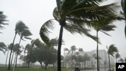 Ocean Drive is seen during a downpour in Miami Beach, Florida, Nov. 8, 2020. A strengthening Tropical Storm Eta cut across Cuba Sunday, and forecasters say it's likely to become a hurricane before Florida Sunday night or Monday morning.
