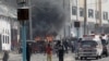 Somali security officers secure the scene of an explosion in Mogadishu, Somalia, Feb. 13, 2021.