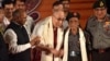 The Dalai Lama (center-left) shakes hands with Naren Chandra Das (center-right), the lone known survivor of a group of seven Indian guards who escorted the Tibetan spiritual leader into India nearly 60 years ago, in Guwahati, the capital of the northeastern Indian Assam state, April 2, 2017.