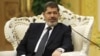 Egypt's President Mohammed Morsi meets with Chinese Vice President Xi Jinping, unseen, at the Great Hall of the People in Beijing, August 29, 2012. 