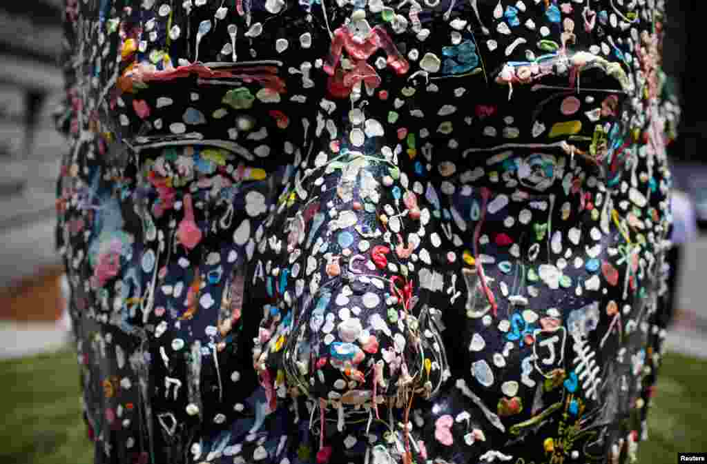 Artist Douglas Coupland's "Gumhead" sculpture is seen outside of the Vancouver Art Gallery in downtown Vancouver, Canada. Coupland invites people to stick chewing gum on the resin and polyester sculpture, which depicts his own head.