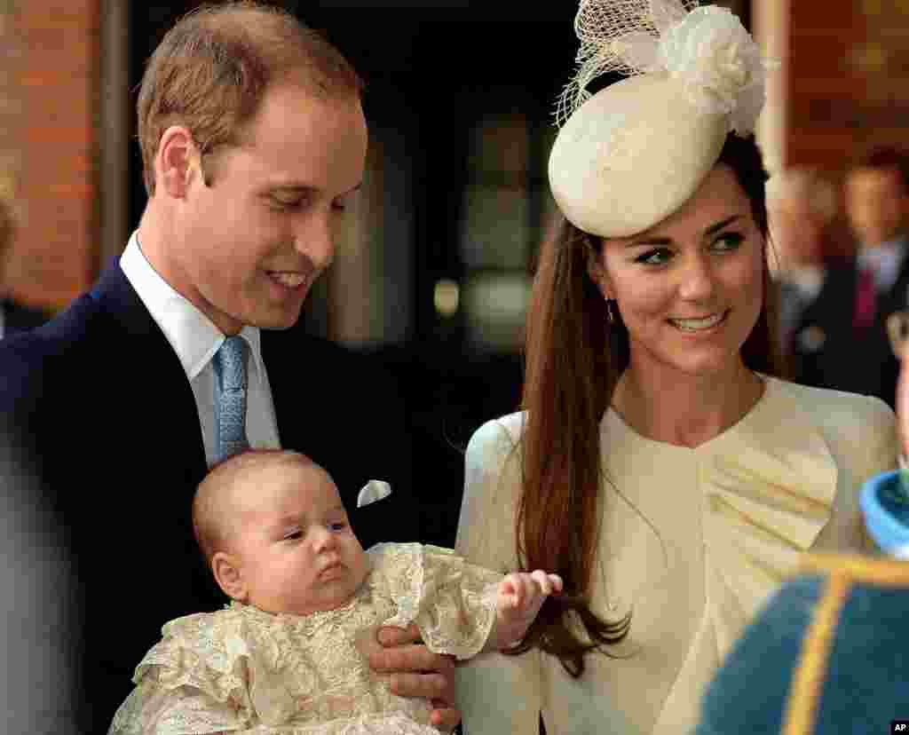 Britain's Prince William and Kate, Duchess of Cambridge, with their son Prince George arrive at Chapel Royal in St James's Palace in London, for the christening of the three month-old Prince George.