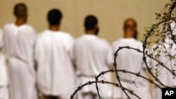 Detainees stand during an early morning Islamic prayer at the U.S. military prison in Guantanamo Bay, Cuba (2009 file photo)