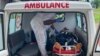 FILE - A handout photo from Medecins Sans Frontieres (Doctors Without Borders) on Oct. 25, 2020, shows a medic treating a victim of a shooting at a bilingual school in Kumba, Cameroon, the day before.