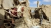 An Afghan man inspects a house destroyed during an air strike called in to protect Afghan and U.S. forces during a raid on suspected Taliban militants, in Kunduz, Afghanistan Nov. 4, 2016.
