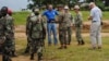 U.S. soldiers and their Liberian counterparts survey a construction site for an Ebola virus treatment center outside Monrovia on Oct. 3, 2014.