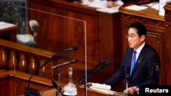 Japan's Prime Minister Fumio Kishida delivers his policy speech during the first day of an ordinary session at the lower house of parliament in Tokyo
