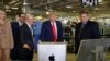 President Donald Trump tours an Apple manufacturing plant, Nov. 20, 2019, in Austin, Texas, with Apple CEO Tim Cook, third from left. 