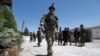 File - Chairman of the U.S. Joint Chiefs of Staff Gen. Mark Milley, left, talks with Gen. Scott Miller, the commander of U.S. and coalition forces in Afghanistan, Dec. 16, 2020 at Miller’s military headquarters in Kabul, Afghanistan. 