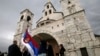 Srpska zastava ispred Srpske pravoslavne crkve u Podgorici, Foto: AP Photo/Darko Vojinovic