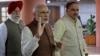 FILE - Indian Prime Minister Narendra Modi, center, arrives for a Bharatiya Janata Party (BJP) parliamentary party meeting in New Delhi, India, Nov. 29, 2016. Modi has been facing public pressure to overhaul political financing following his drastic move last November of banning high denomination notes to flush out illicit cash.