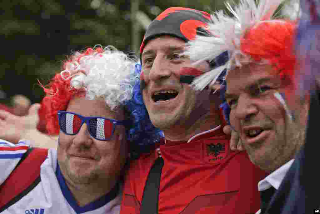 France's and Albania's soccer team supporters cheer together ahead of the Euro 2016 Group A soccer match between France and Albania at the Velodrome stadium in Marseille, France.