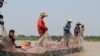 Villagers are fishing in Tonle Sap Lake in Kampong Chhnang province’s Chhnuk Trou, on March 12, 2020. (Sun Narin/VOA Khmer)