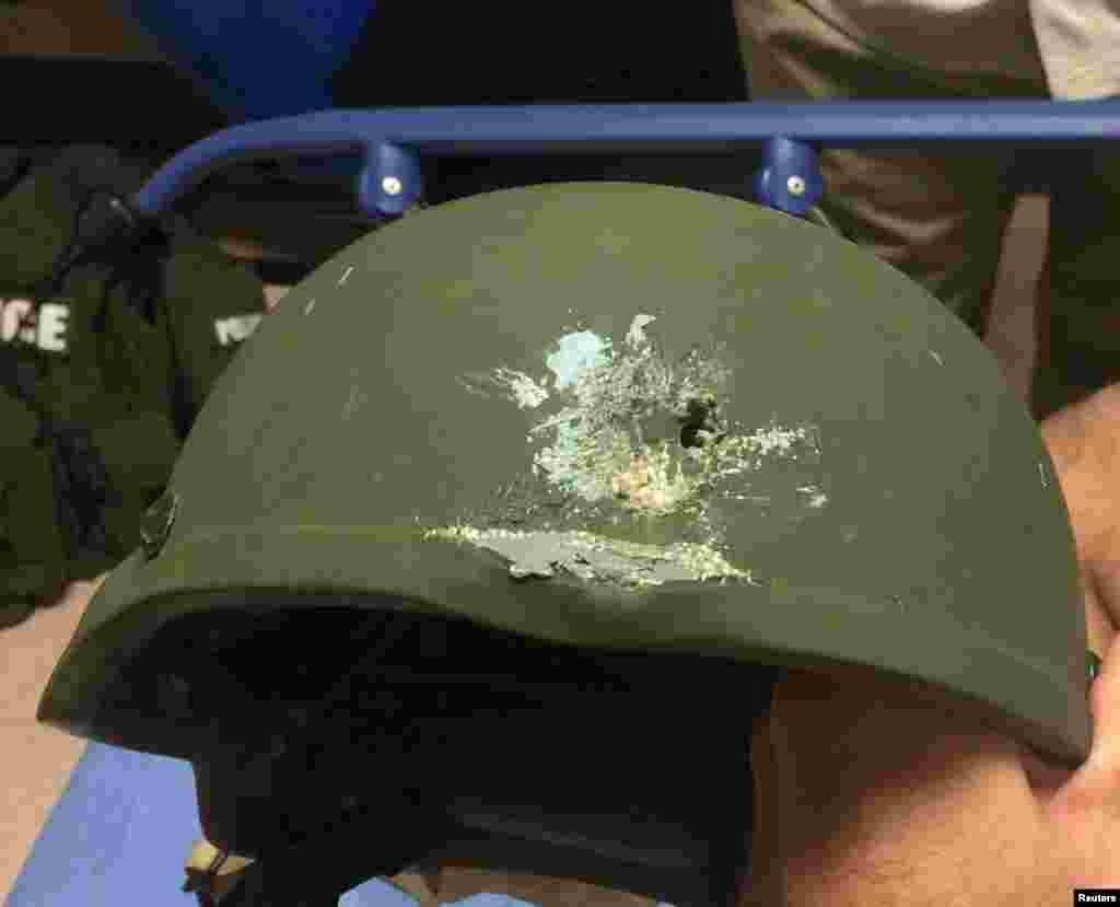 A handout photograph posted by the Orlando Police Department on Twitter with the words, "Pulse shooting: In hail of gunfire in which suspect was killed, OPD officer was hit. Kevlar helmet saved his life", in reference to the operation against a gun man inside Pulse night club in Orlando, Florida on June 12, 2016.