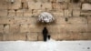 FILE - An ultra-Orthodox Jewish man prays at the Western Wall, the holiest site where Jews can pray in Jerusalem's old city, Feb. 20, 2015.