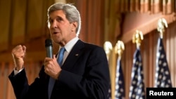 U.S. Secretary of State John Kerry speaks to staff from the U.S. Embassy in Kuwait City, Kuwait, June 26, 2013.