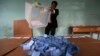 An Afghan election official empties a ballot box for counting at the end of polling in Herat Province, Apr. 5, 2014. 