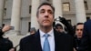 Michael Cohen walks out of federal court in New York, Nov. 29, 2018, after pleading guilty to lying to Congress about work he did on an aborted project to build a Trump Tower in Russia. Cohen told the judge he lied about the timing of the negotiations.
