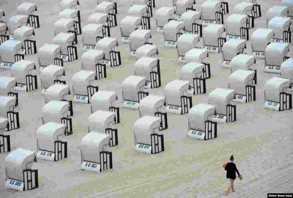 Unusually empty beach chairs sit idle during summertime, at the Baltic Sea beach of Sellin on Ruegen island, Germany.
